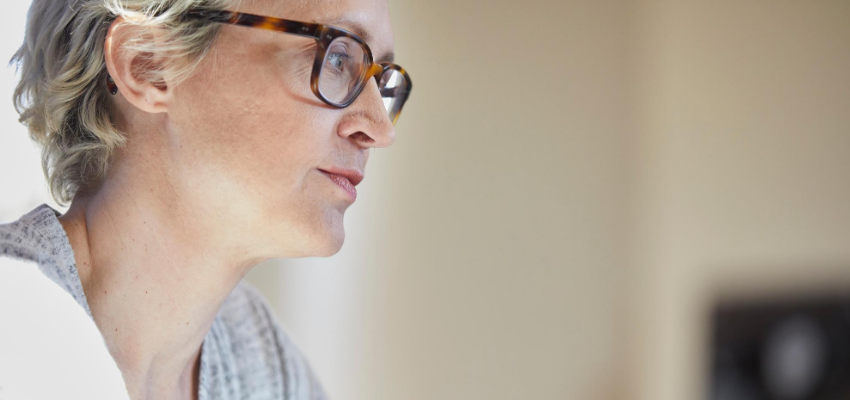 Woman in glasses working